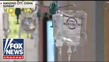 Chinese hospitals overwhelmed by &#39;mystery pneumonia&#39; cases