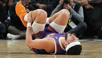 Suns' Booker sprains right ankle; X-rays negative