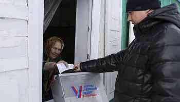 Russians cast final ballots in election preordained to extend Vladimir Putin's rule