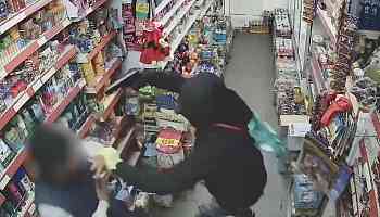 CCTV captures terrifying moment man holds newsagent at gunpoint in armed robbery