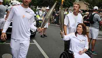Lebanese journalist wounded in Israeli strike carries Olympic torch