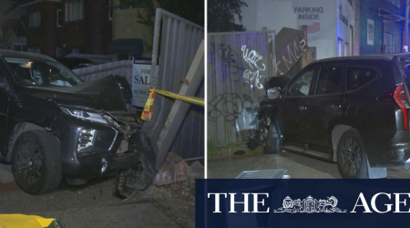 Car smashes through Sydney fence