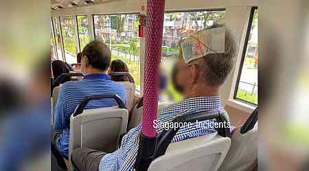 'This is his pain killer': Netizens get creative after man spotted with $50 bill tied to his head on bus 