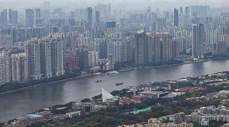 China property shares jump as major cities ease buying curbs