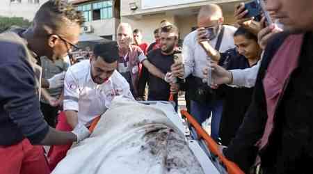 A Gaza medic realizes he's carrying his own mother's body, killed by an Israeli airstrike