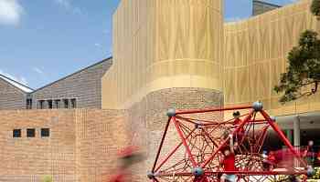 Fjcstudio wraps Sydney school in perforated aluminium facade