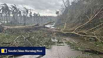 Super Typhoon Man-Yi weakens as it sweeps through the Philippines