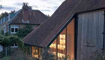 Ashton Porter Architects reworks 15th-century barn into tactile pottery studio