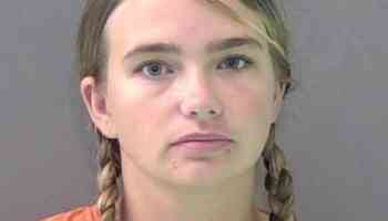 Woman accused of leaving child alone while out of town