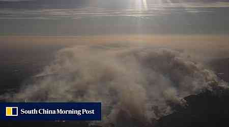 Firefighters advance on destructive blaze in California, aided by slower winds