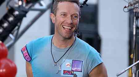 Chris Martin kisses tarmac before boarding plane in Sydney