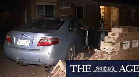 Chaos on Adelaide street after driver crashes into parked car