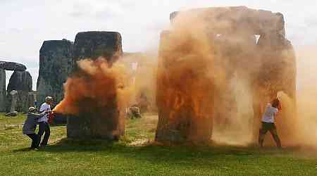 Two charged after orange paint powder thrown over Stonehenge in Just Stop Oil protest 