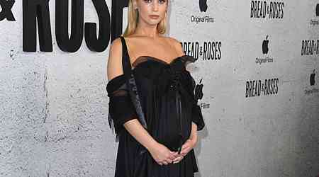  Pregnant Jennifer Lawrence Cradles Baby Bump on Red Carpet 