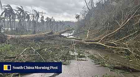 Super Typhoon Man-Yi weakens as it sweeps through the Philippines