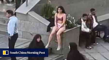 Iran says no charges against student who stripped to her underwear