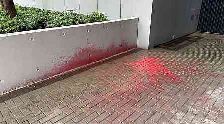 Red paint splashed outside government offices