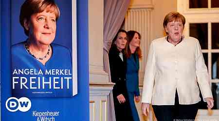 Merkel defends controversial decisions at book launch