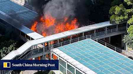 Fire engulfs and destroys part of large noise barrier on busy Hong Kong road