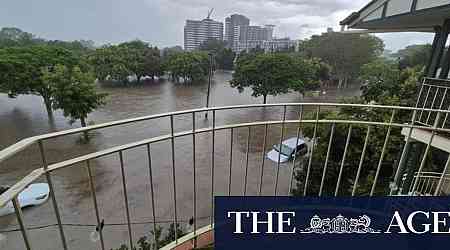 Brisbane residents issued flood warning as storms batter south-east