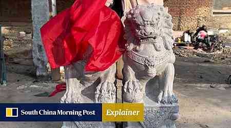 Why red cloth covers guardian stone lions in China during auspicious events