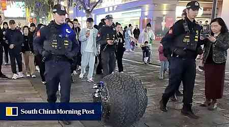 Officers on patrol in China test ball-shaped robot as Beijing pushes hi-tech policing