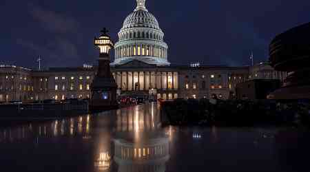 Biden signs bill that averts a government shutdown and brings a close to days of Washington upheaval