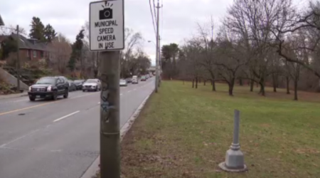 Toronto speed camera chopped down again and thrown into pond