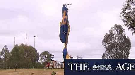 Hot air balloon wraps around lighting tower in Melbourne