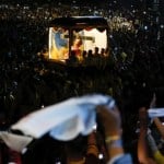 Catholics pray for good health and peace in huge procession venerating Jesus statue