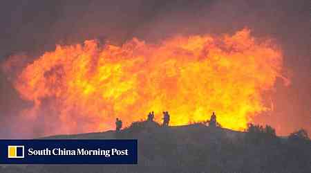 Firefighters race to contain Los Angeles wildfires before menacing winds return