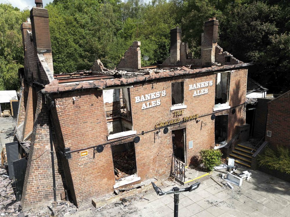 Cheers to being crooked again. Quirky English pub bulldozed after a fire to be rebuilt as it was