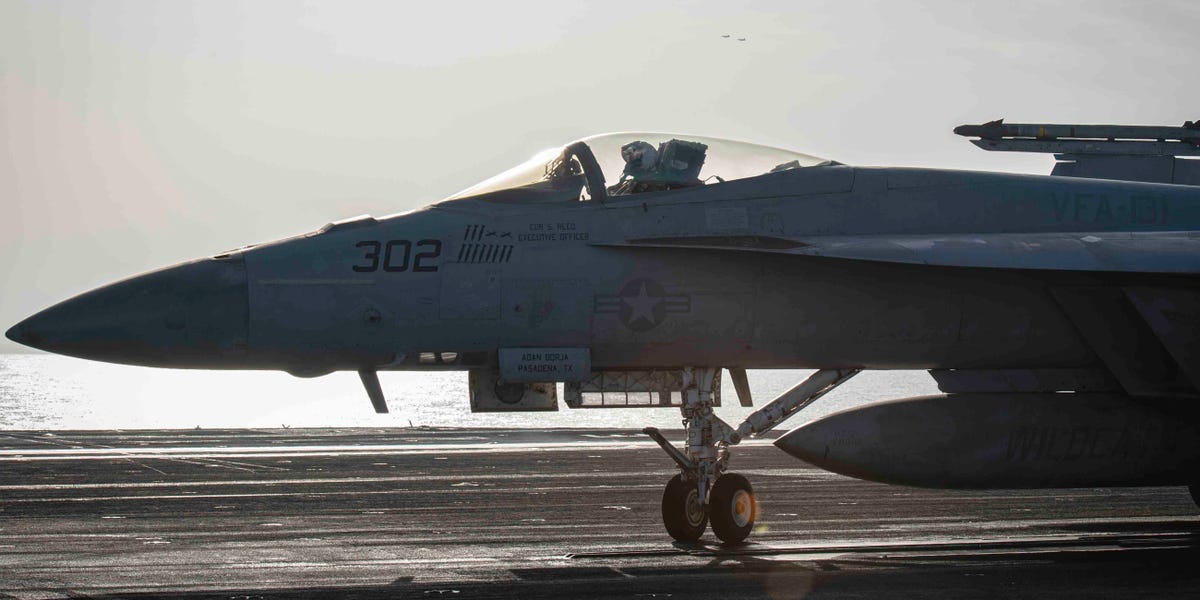 Super Hornet fighter jets on the deck of a US Navy aircraft carrier in the Red Sea are sporting Houthi drone kill marks