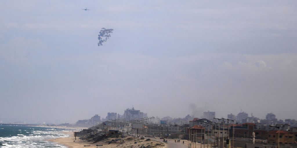 Palestinians are drowning trying to reach parcels airdropped into the sea, paramedics say