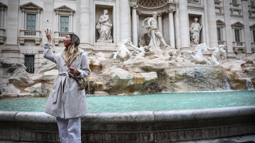 Visitors' coins in Rome's Trevi Fountain provide practical help to Italians