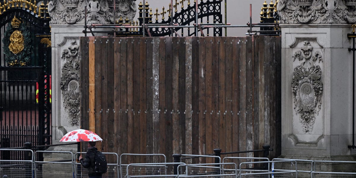 Buckingham Palace's gates are boarded up after someone crashed a car into them, police say