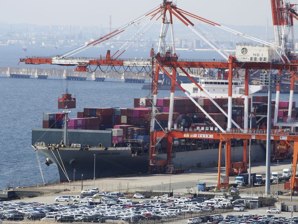 Japan records a trade deficit for the third straight fiscal year despite recovering exports