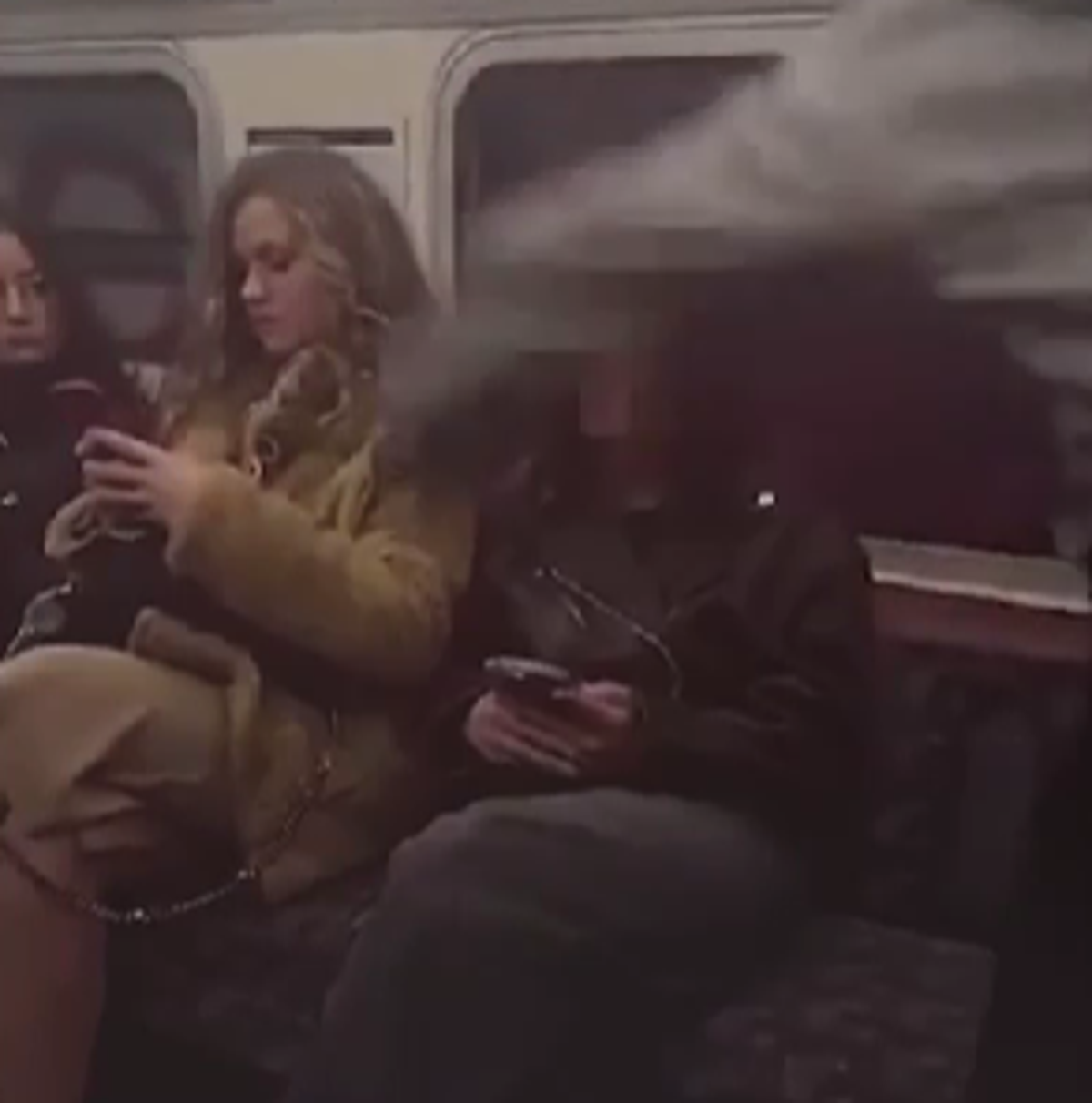 Police appeal after video shows woman 'looking for online clout' randomly punching Tube passenger