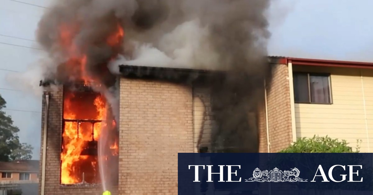 Townhouse gutted by fire after neighbours threated with gun
