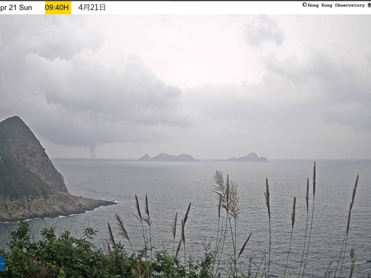 Trees tumble, waterspout forms as storms buffet HK