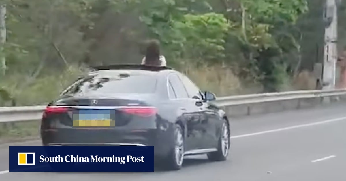 Viral Hong Kong video of woman standing up through car sunroof on highway prompts warning
