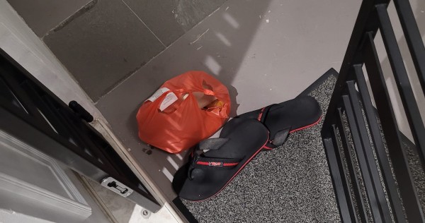 'Where did you learn your manners from?' Man upset after food delivery rider leaves order beside slippers on ground