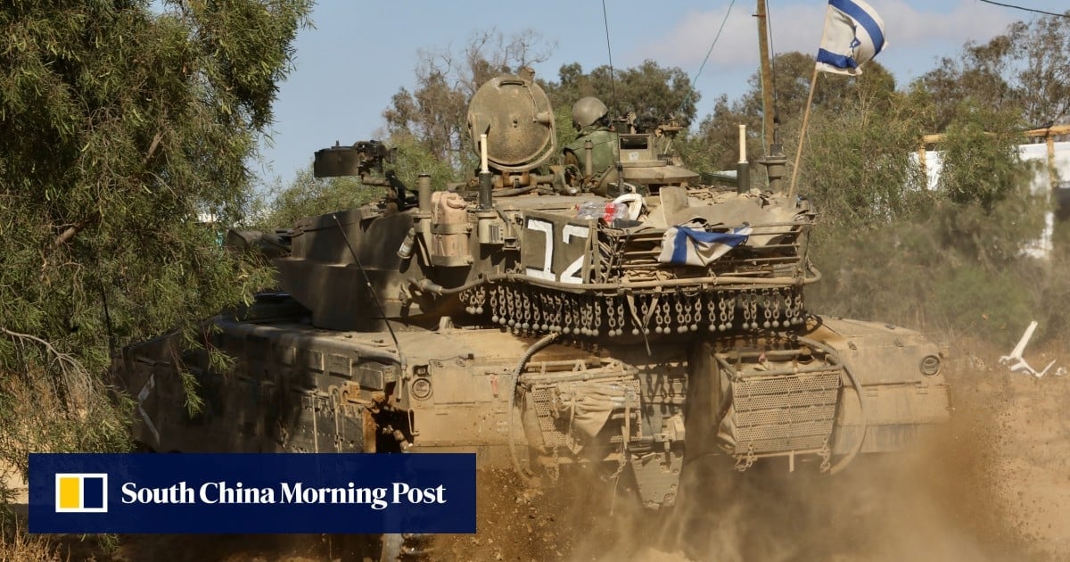 Israel reopens key Rafah crossing for aid to enter Gaza, as US pauses bomb shipment