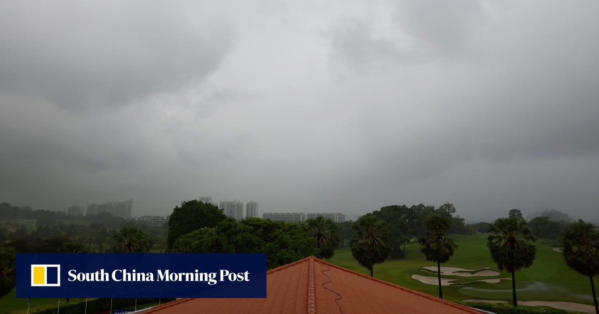 Singapore issues flood warnings as heavy rain causes delays in several flights, major golf event
