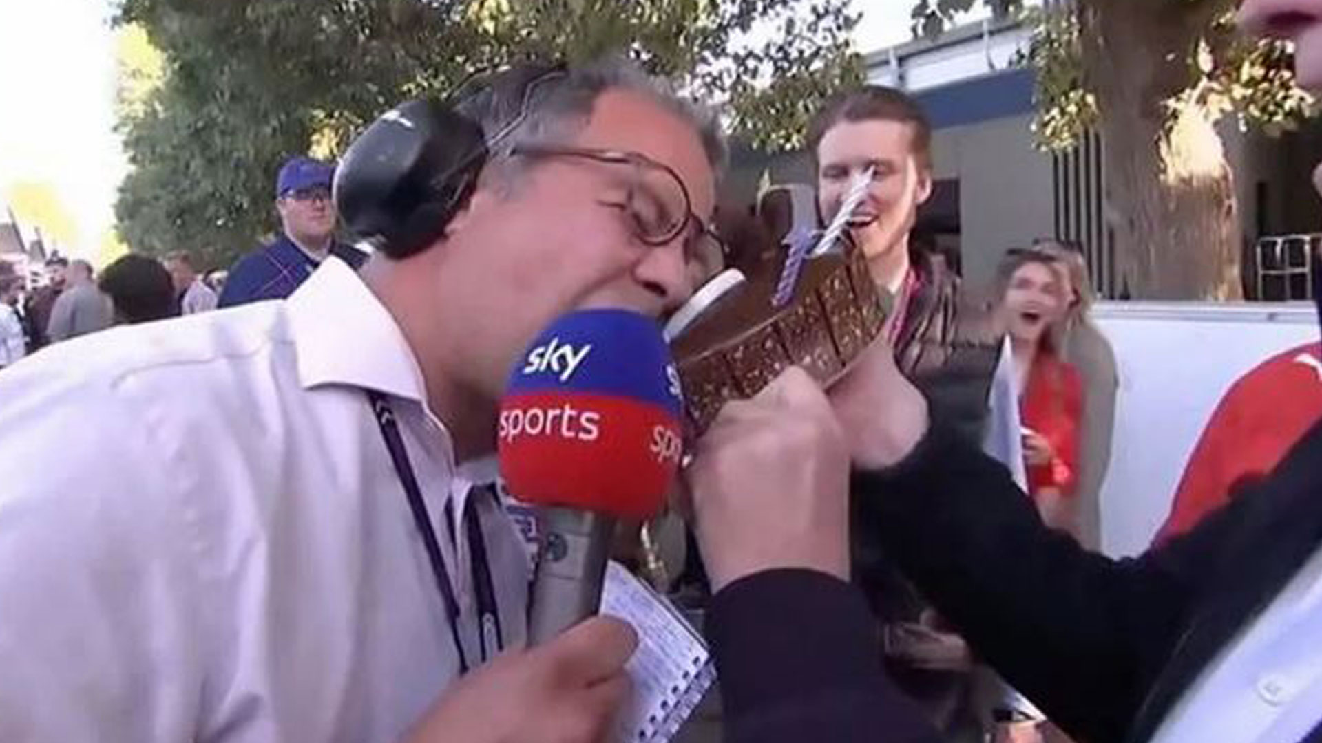 Sky Sports F1 legend Ted Kravitz covered in cake as Ferrari engineer tries to KISS him live on TV during Australian GP