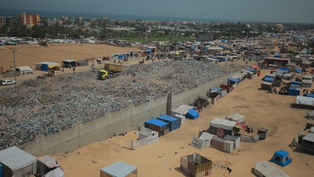 Gazans fleeing Rafah say they now live 'in misery' next to garbage dump in Khan Younis