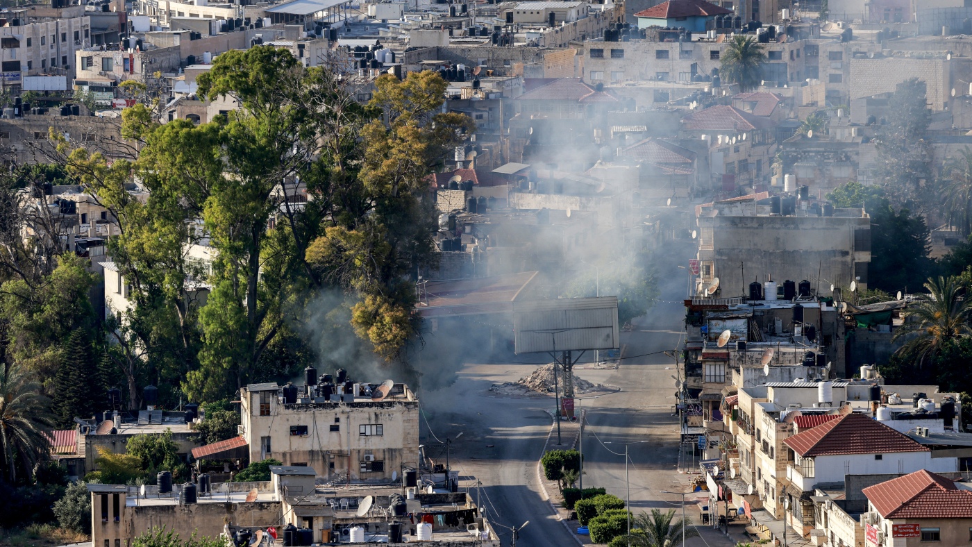 Israel's military is investigating an incident in which a Palestinian was strapped to a vehicle