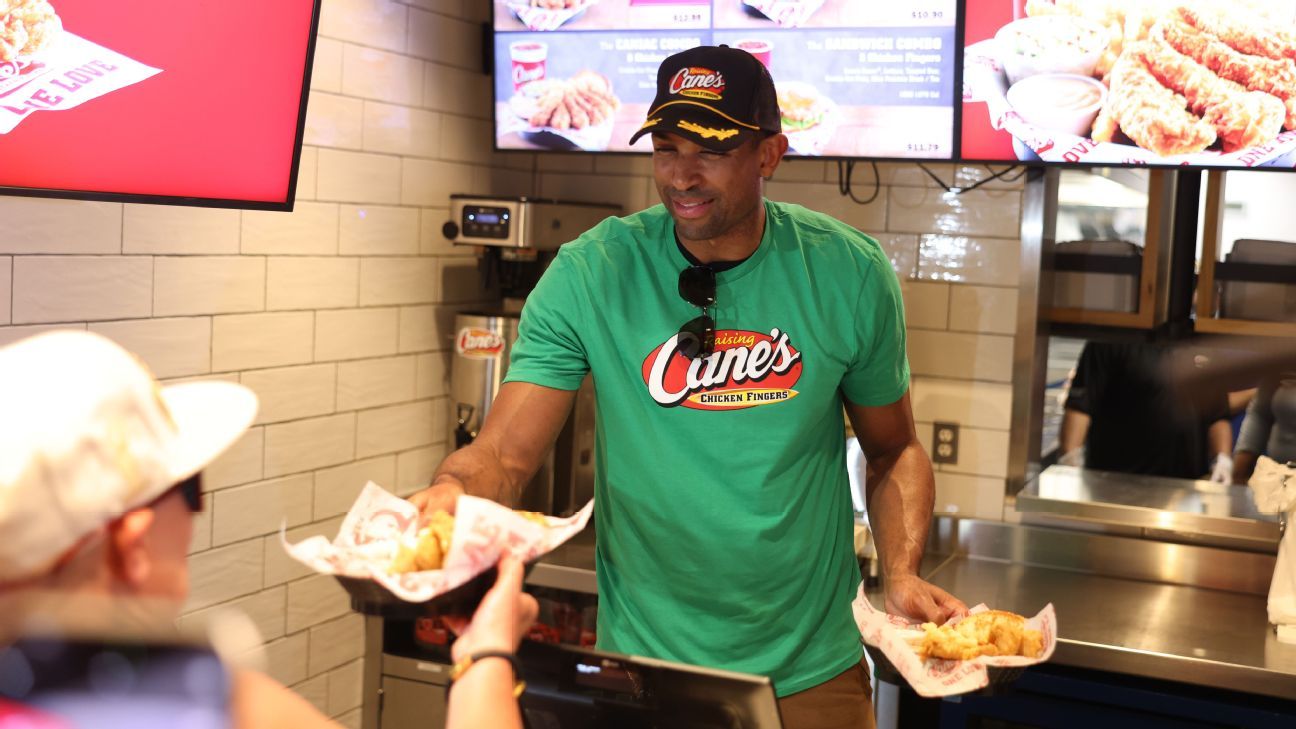 Boston Celtics center Al Horford serves food to fans at Raising Cane's