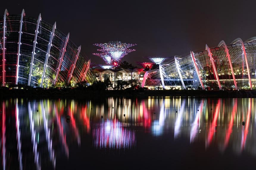 Gardens by the Bay lights up in red and white to celebrate 12th birthday and TripAdvisor win