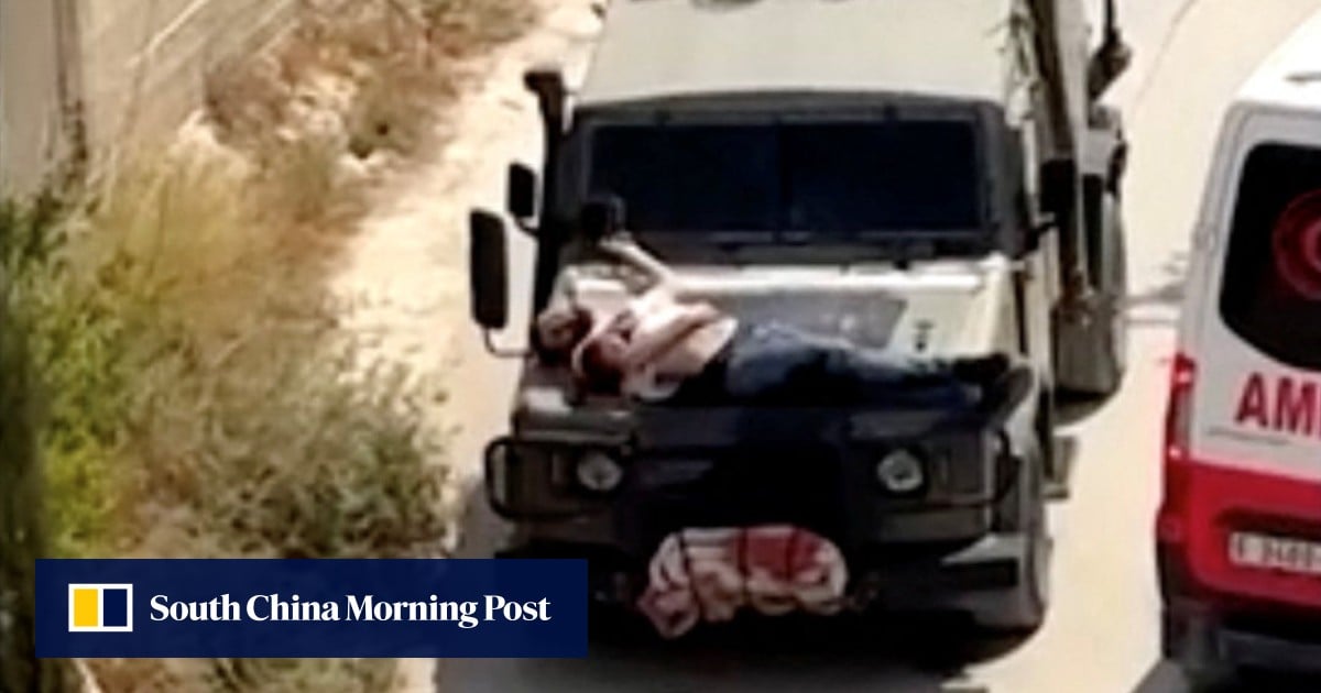 Israeli soldiers wound Palestinian, tie him to hood of jeep and drive off